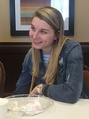 rachel sitting at a table