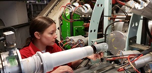 Mariah Goeks installing radiation shield