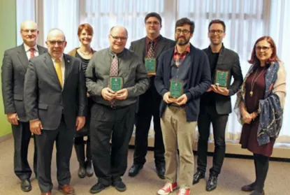 Faculty with their awards