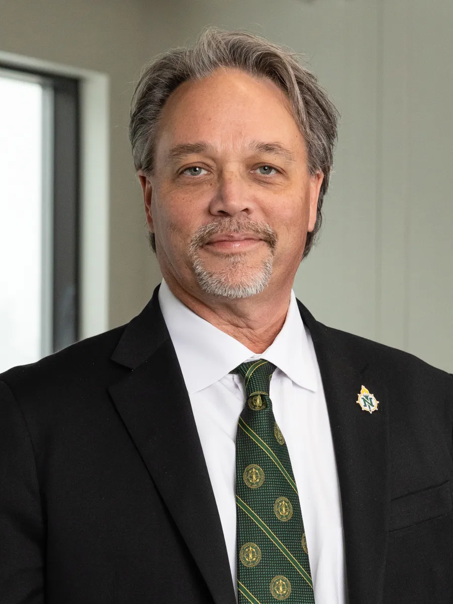Headshot of NMU President Chris Olsen. 