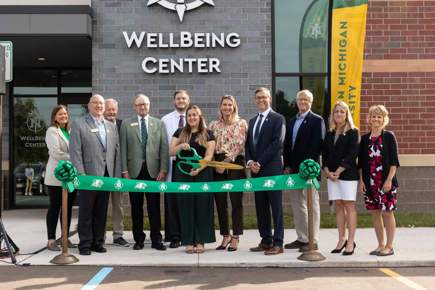 President Tessman with a group of people at the WellBeing Center dedication ceremony
