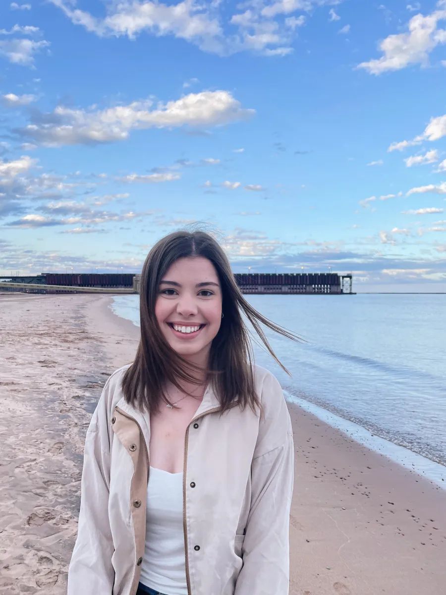 Graduate assistant Haley Ziegler smiling by the ore dock