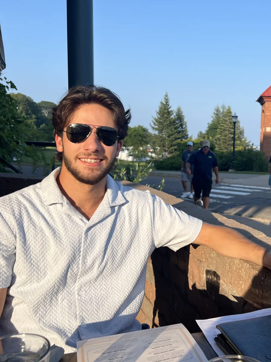 Graduate Assistant Mike smiling at Iron Bay Restaurant