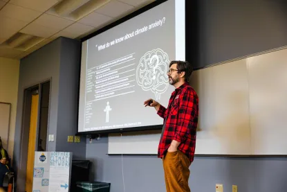 Dr. Joshua Carlson lectures about climate anxiety