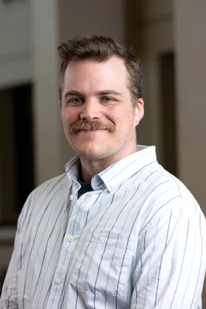 Professional headshot of Alex Lekander who is a NMU Master's in Psychology alumni