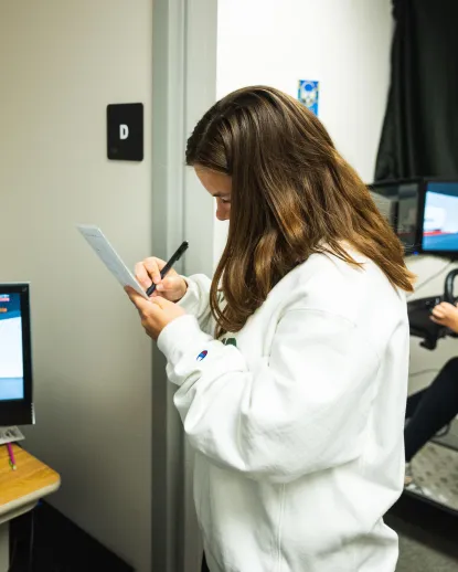 Student taking data in the lab