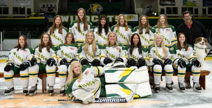 Women's hockey team photo on ice.