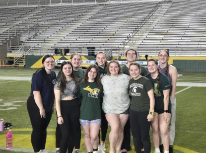 Stunt & Comp team photo in Superior Dome on the turf.