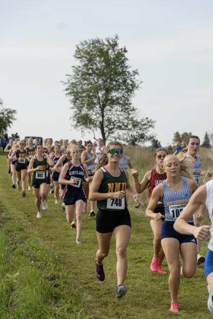 Cross Country race with photo of NMU student athletes