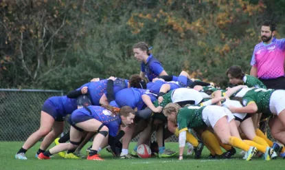 Pic of rugby scrum during game.