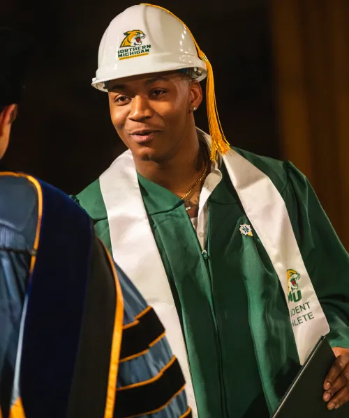 Student accepting diploma at graduation