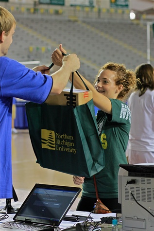 Student receiving laptop