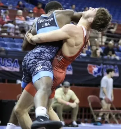 Image shows Charles Dill wrestling