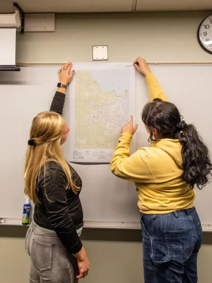 Student Looking at a map