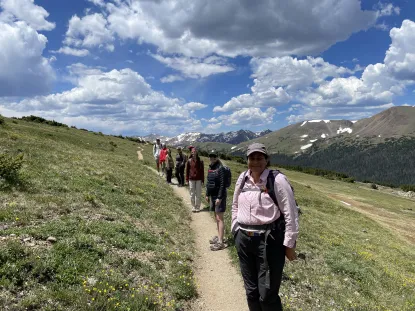 Team standing in a row during hike