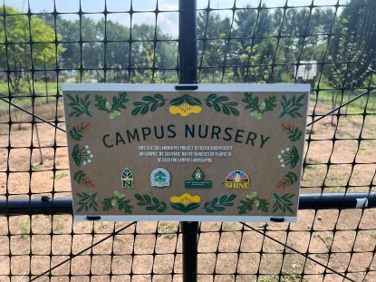 Descriptive sign located on nursery fence