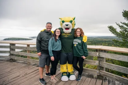 Dad, mom and student with Wildcat Willy on Sugarloaf Mountain