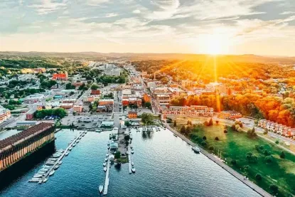 an arial photo of marquette michigan featuring the waterfront and geographical landscape