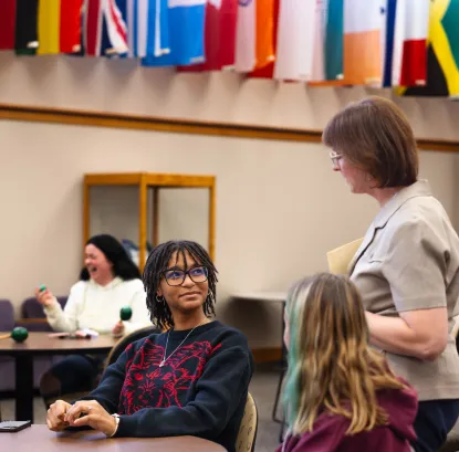 Language professor speaking with a student 