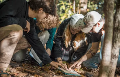 Students working in the soil lab outside