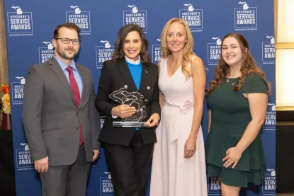 Photo of SLFP Staff members with Gov. Whitmer