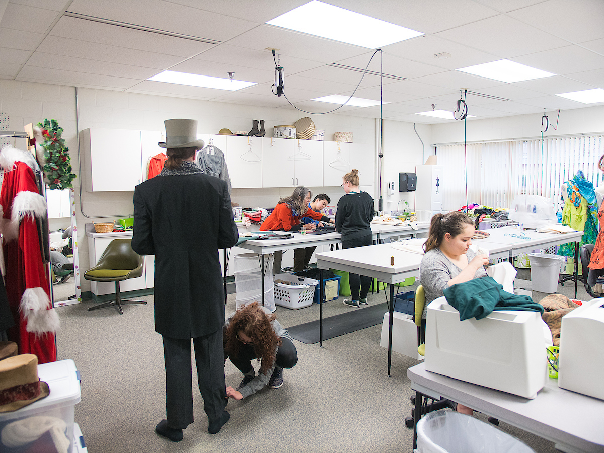 students working in costume shop