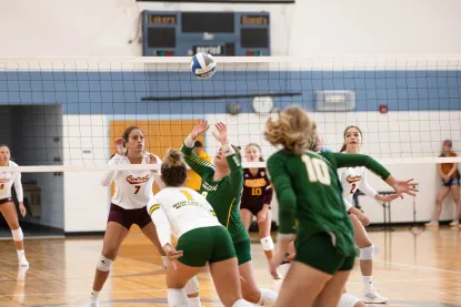 NMU Women's Volleyball players in action