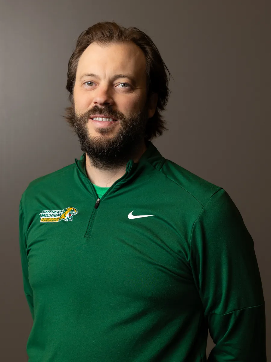 male faculty in NMU green quarter zip