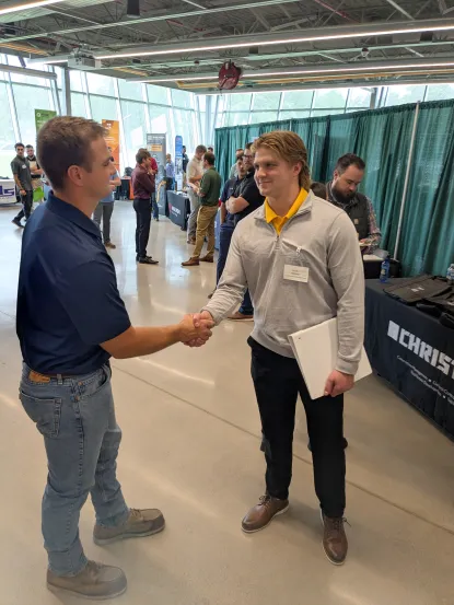 CM senior shaking hands with potential employer