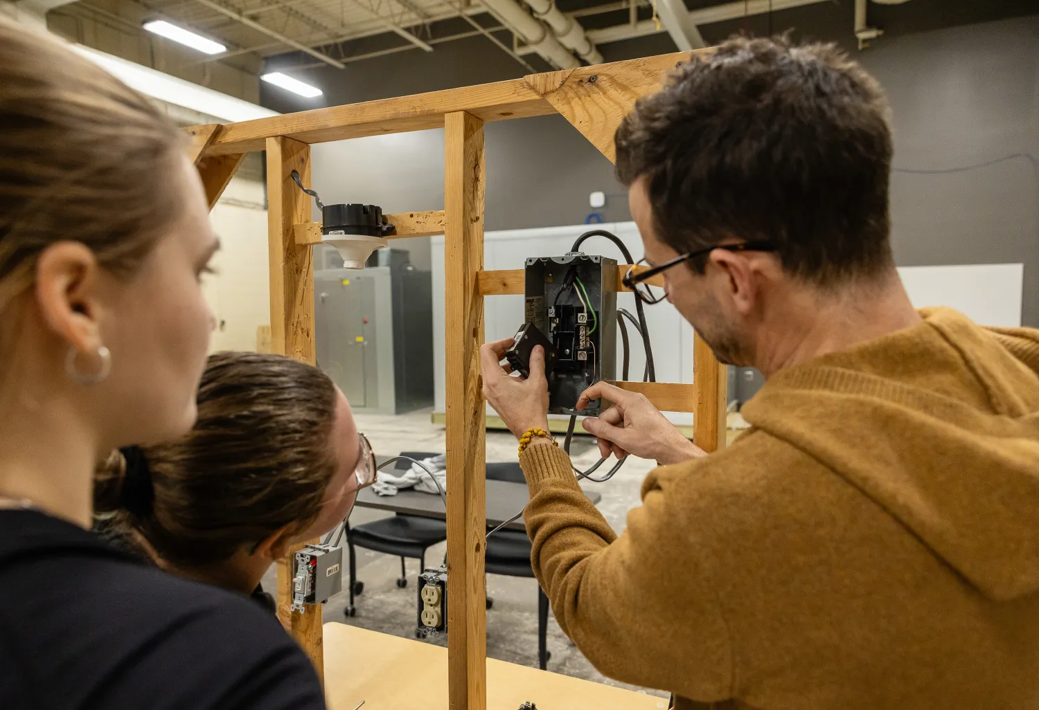 Students learning electrical wiring