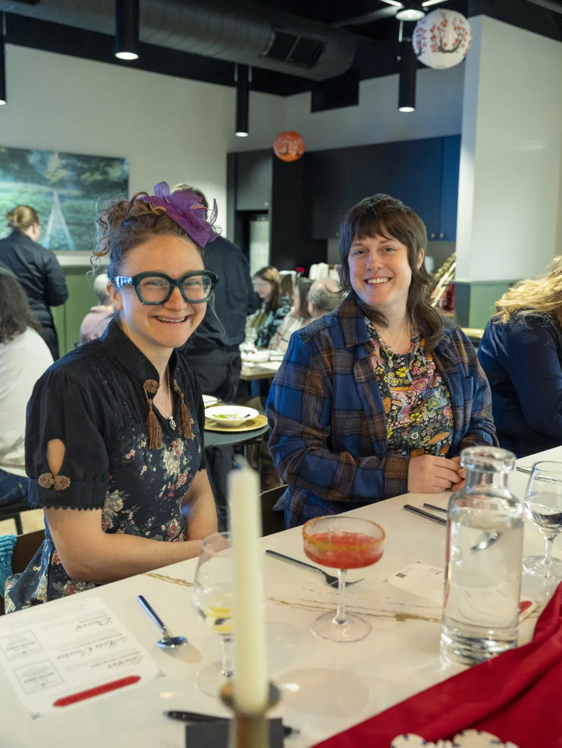 Guests at the bar during an event smile for the camera