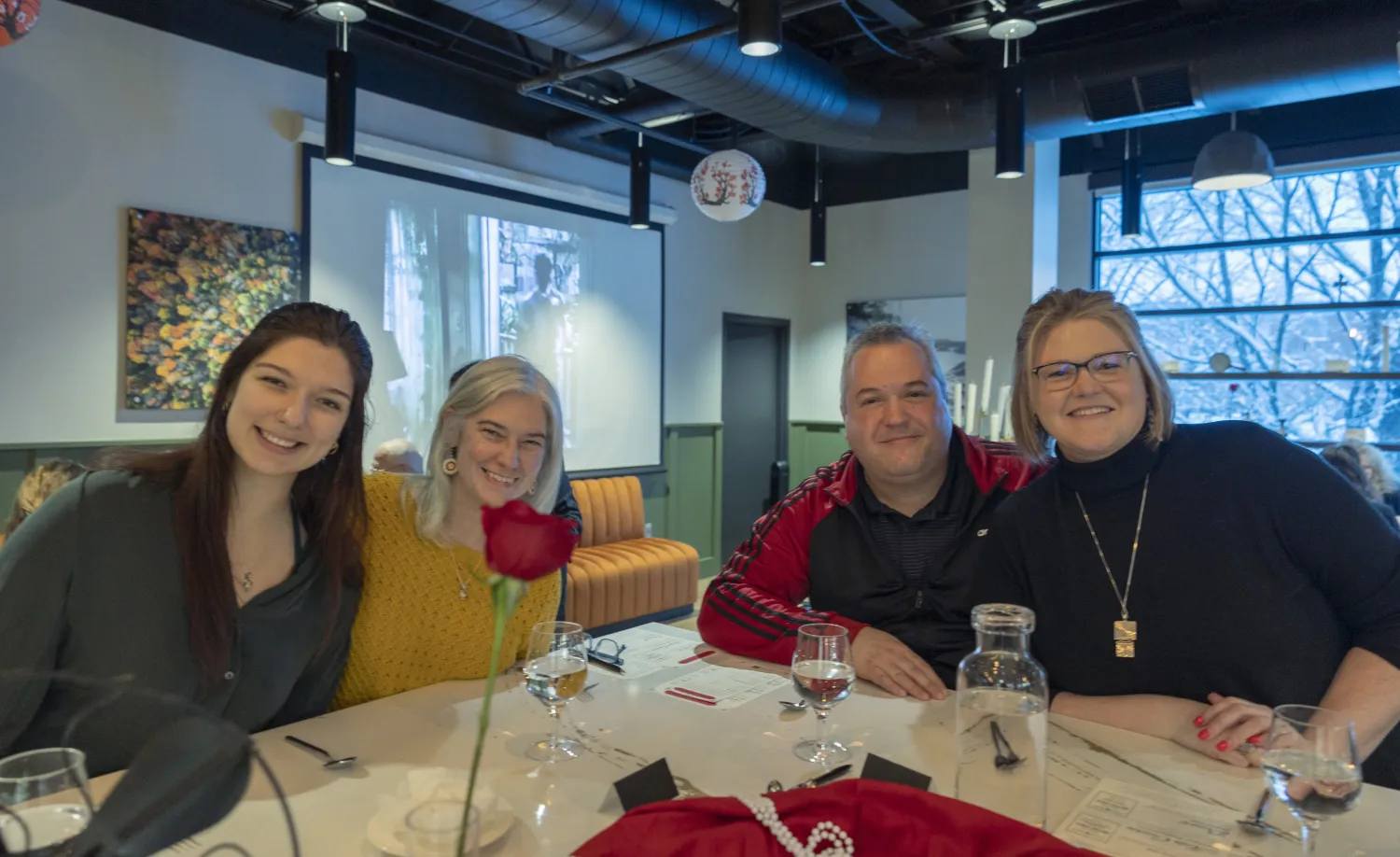 Guests at the bar smiling