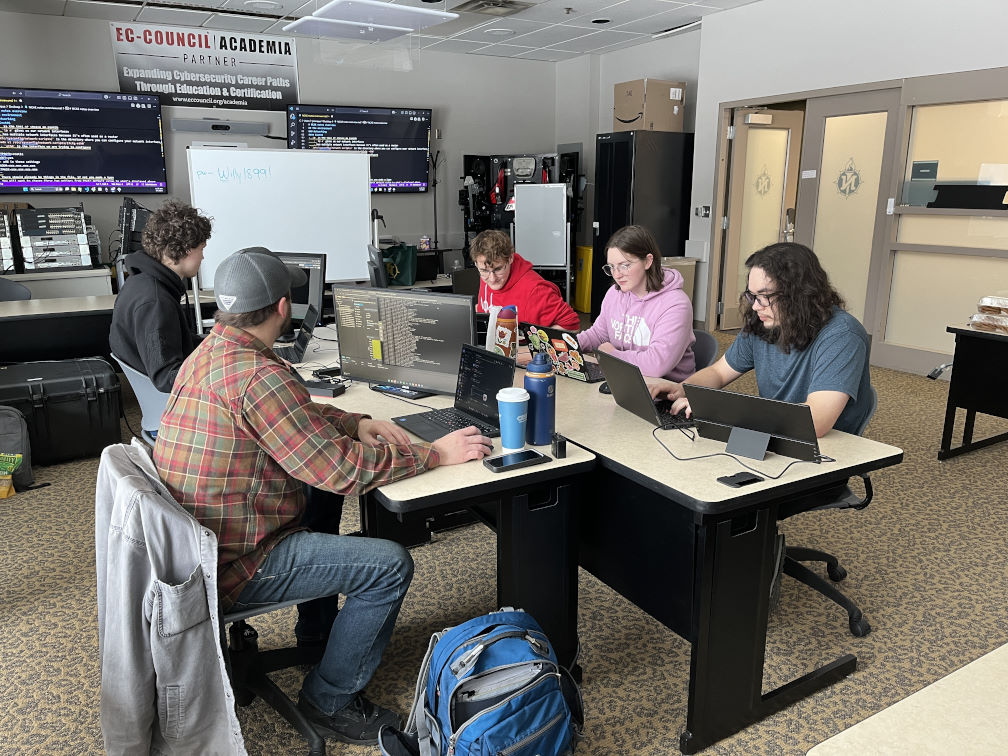 NMU Cyber Team on keyboards