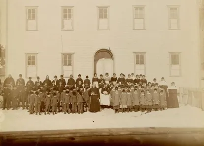 Students in front of a boarding school