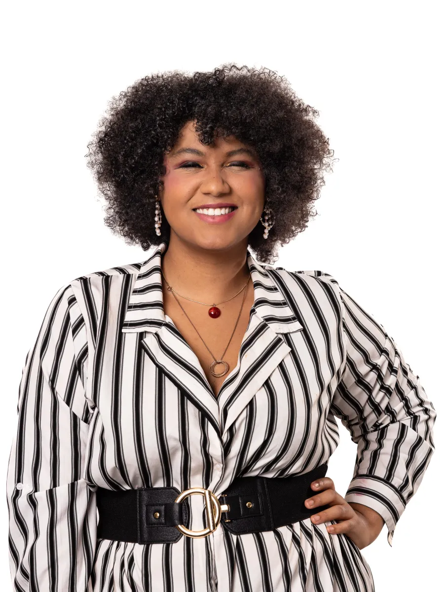Headshot image of peer educator. She is wearing a white and black vertically striped jumpsuit with a black belt.