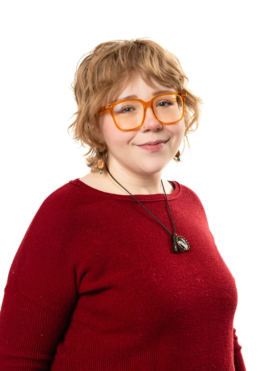 Image of peer educator in red long sleeve top.