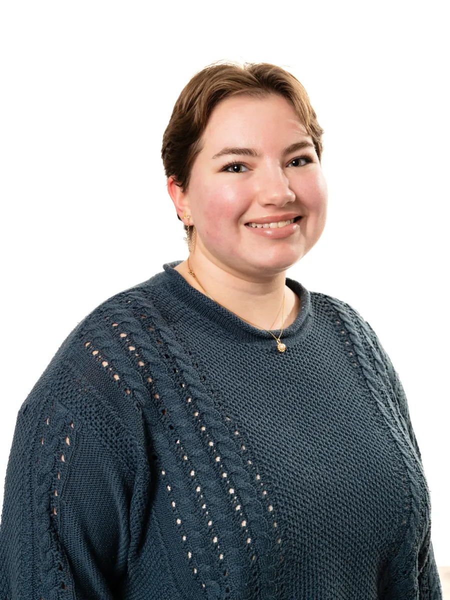 Image of peer educator in green sweater