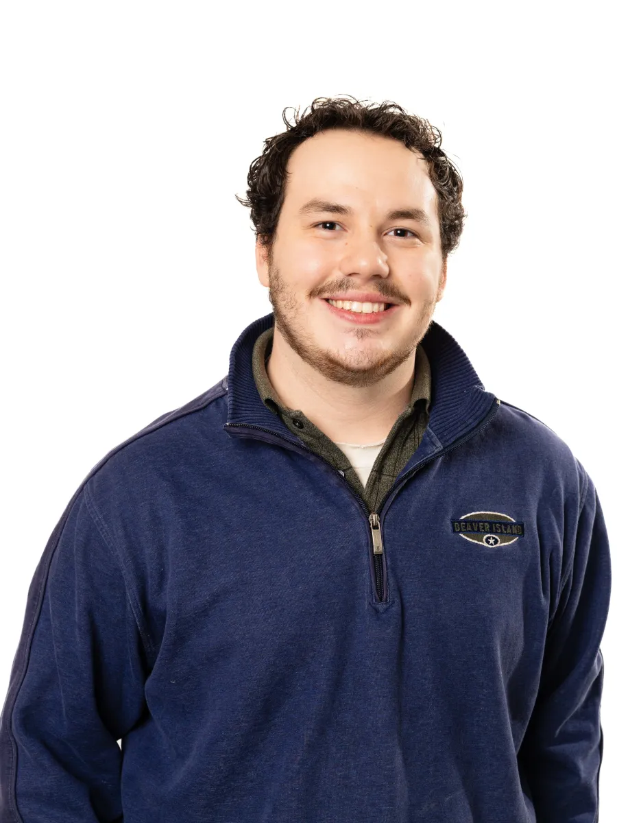 Image of peer educator in blue quarter zip.