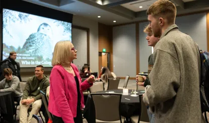 faculty and student chatting